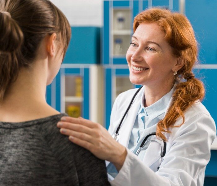 doctor consulting patient smiles 1 e1691074190490